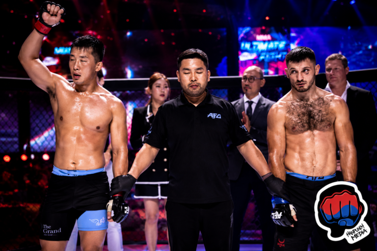Sang Uk Kim defeats