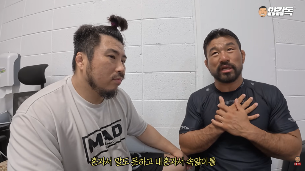Myung Ho Bae discussing with Coach Yang on ZFN and Black Combat