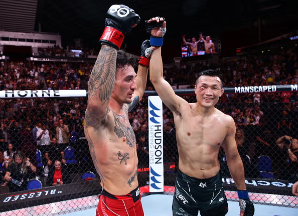 Max Holloway and Chan Sung Jung fight in UFC