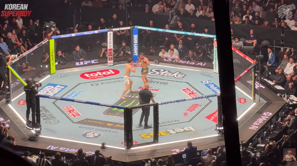 Doo Ho Choi in octagon with Patricio Pitbull